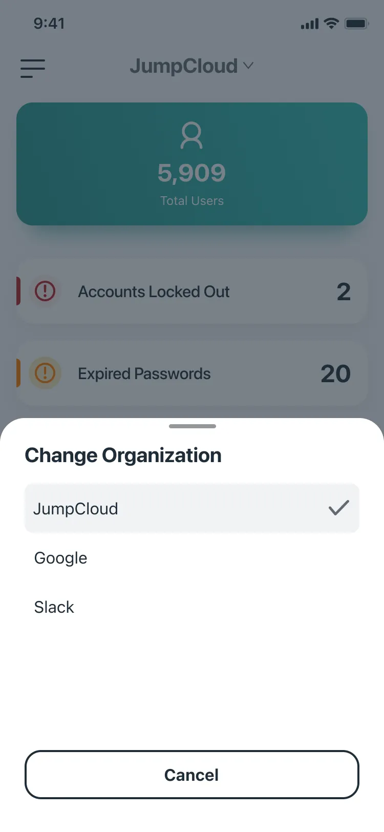 A Change Organization sheet over the dashboard with JumpCloud checked, Google and Slack below, and a Cancel button.